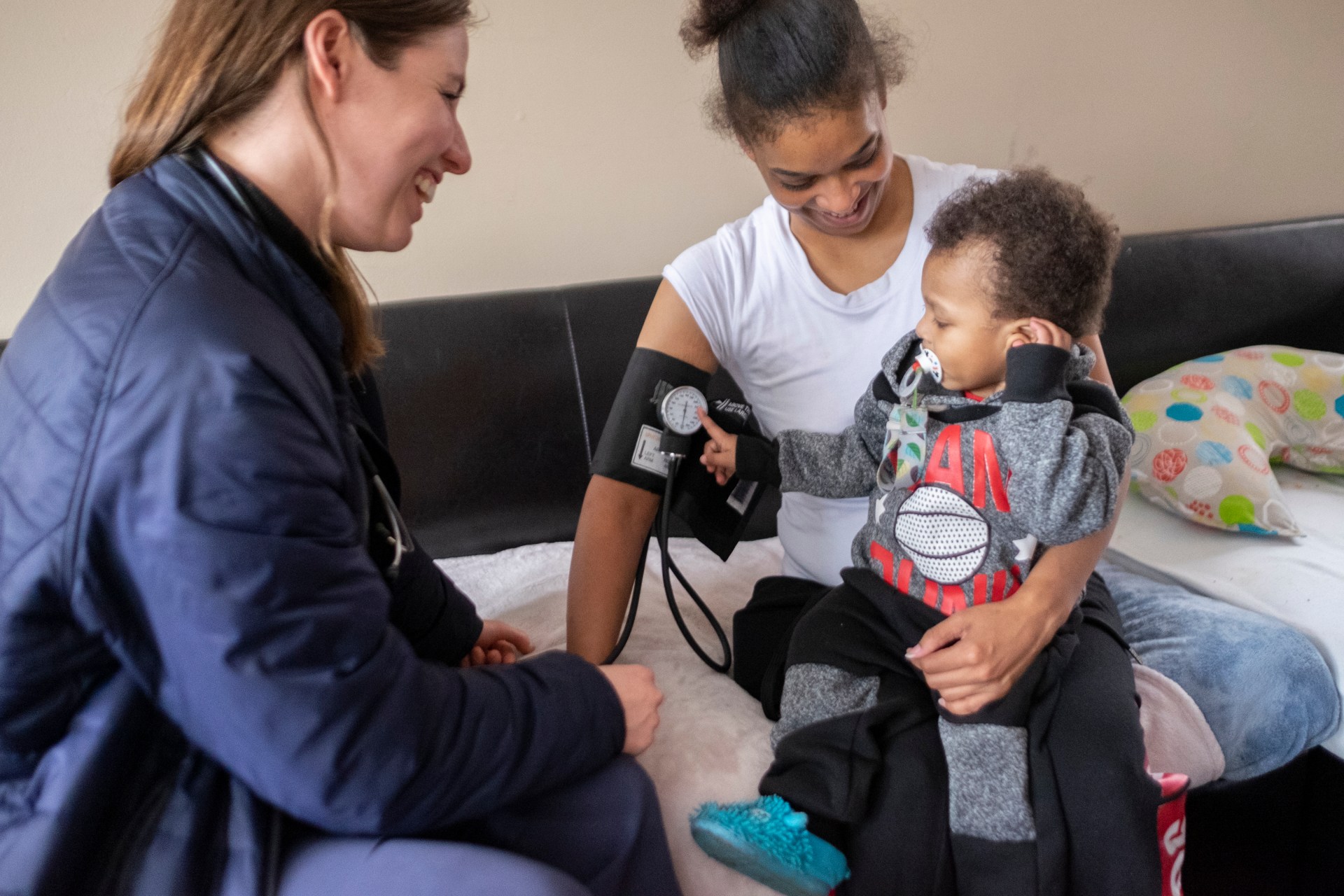 Medical professional with mother and son
