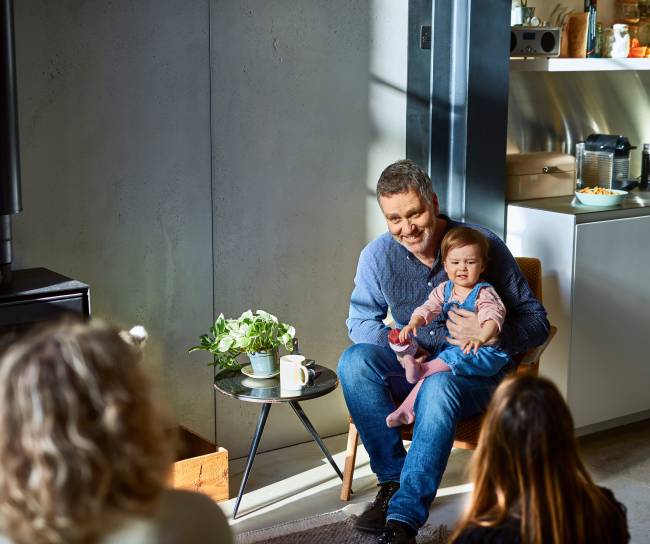 Man holding a toddler