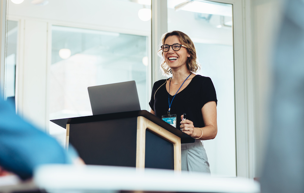 Female presenting at conference